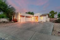 14687 W Amelia Ave, Goodyear, AZ 85395 - adobe home with a garage and driveway