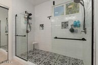 14687 W Amelia Ave, Goodyear, AZ 85395 - bathroom featuring a shower stall