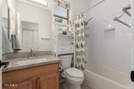 14687 W Amelia Ave, Goodyear, AZ 85395 - full bath featuring vanity and shower / bath combination with curtain