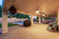 14687 W Amelia Ave, Goodyear, AZ 85395 - fenced backyard with a patio area