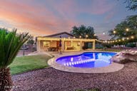 14687 W Amelia Ave, Goodyear, AZ 85395 - swimming pool with a patio and a hot tub