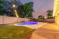 14687 W Amelia Ave, Goodyear, AZ 85395 - view of swimming pool with a fenced backyard and a patio area