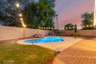 14687 W Amelia Ave, Goodyear, AZ 85395 - view of swimming pool featuring a fenced backyard