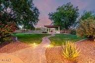 14687 W Amelia Ave, Goodyear, AZ 85395 - view of property's community with a yard