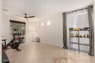 14687 W Amelia Ave, Goodyear, AZ 85395 - exercise room with a ceiling fan