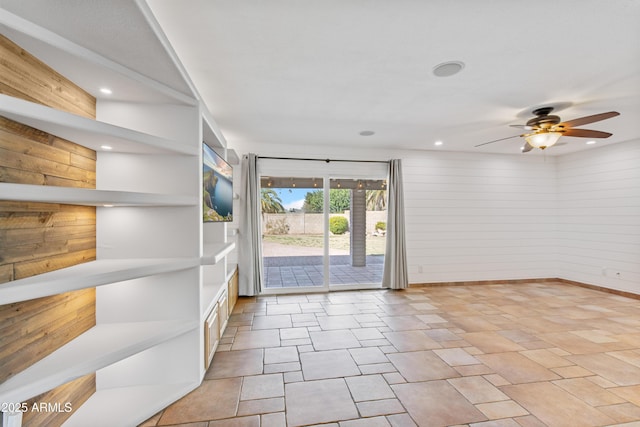 interior space with recessed lighting, baseboards, and ceiling fan