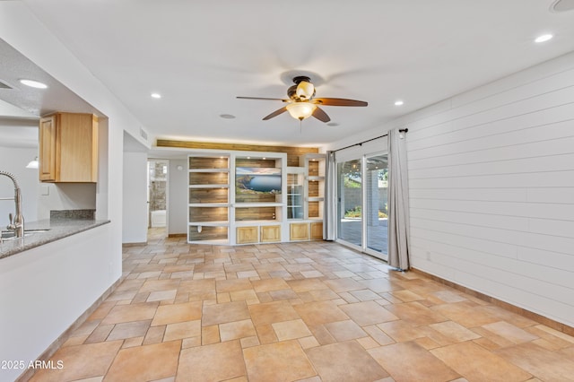 interior space with recessed lighting, a ceiling fan, visible vents, and a sink