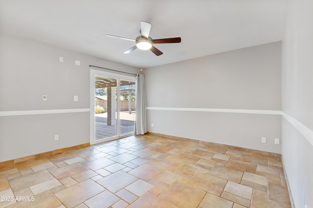 unfurnished room featuring baseboards and ceiling fan