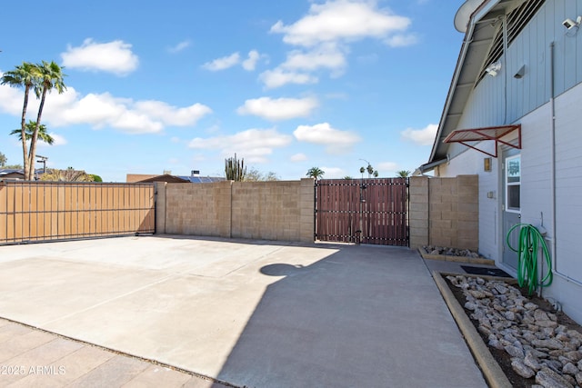 view of patio / terrace with fence and a gate