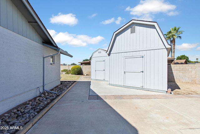 view of shed with fence