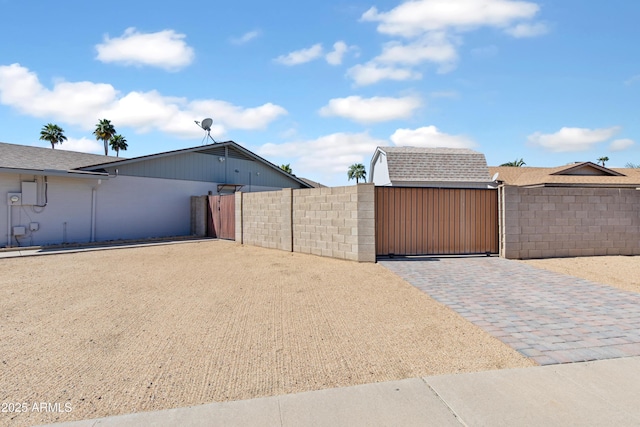 view of gate with fence