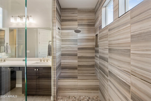 bathroom featuring vanity, tile patterned floors, and walk in shower