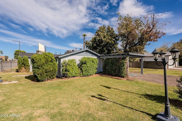 view of front of house featuring a front yard and a carport