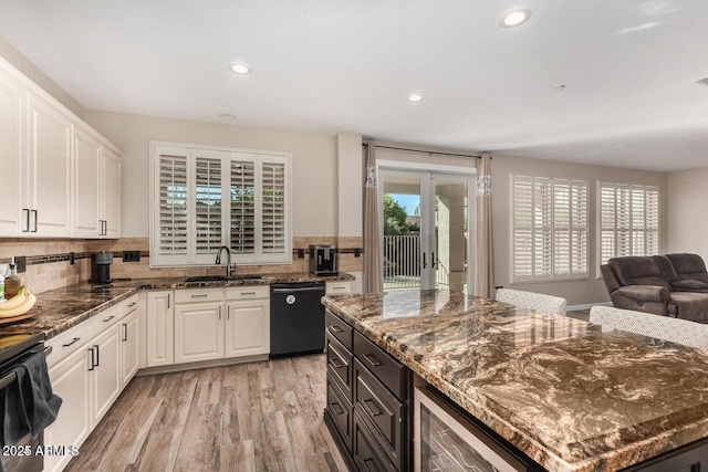 9566 N 83rd Dr, Peoria, AZ 85345 - kitchen featuring black appliances, white cabinetry, light wood-style floors, and a sink