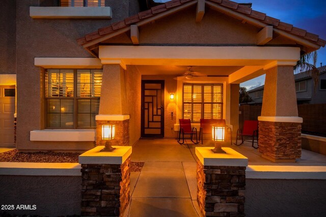 9566 N 83rd Dr, Peoria, AZ 85345 - exterior space with stucco siding, a ceiling fan, and a patio area