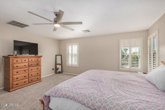 9566 N 83rd Dr, Peoria, AZ 85345 - carpeted bedroom with visible vents, ceiling fan, and baseboards