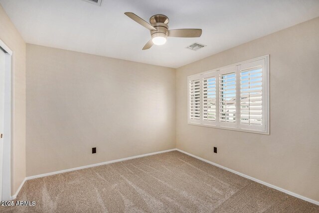 9566 N 83rd Dr, Peoria, AZ 85345 - spare room featuring baseboards, visible vents, a ceiling fan, and carpet floors