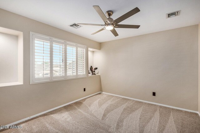 9566 N 83rd Dr, Peoria, AZ 85345 - empty room with visible vents, a ceiling fan, carpet flooring, and baseboards