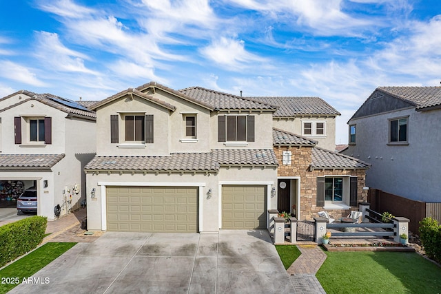 22771 N 98th Dr, Peoria, AZ 85383 - mediterranean / spanish-style home with a tiled roof, stucco siding, concrete driveway, and an attached garage