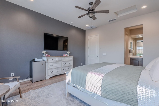 22771 N 98th Dr, Peoria, AZ 85383 - bedroom featuring attic access, light wood-style floors, freestanding refrigerator, recessed lighting, and baseboards