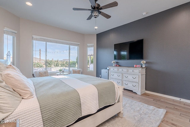 22771 N 98th Dr, Peoria, AZ 85383 - bedroom featuring light wood-type flooring, baseboards, recessed lighting, and a ceiling fan