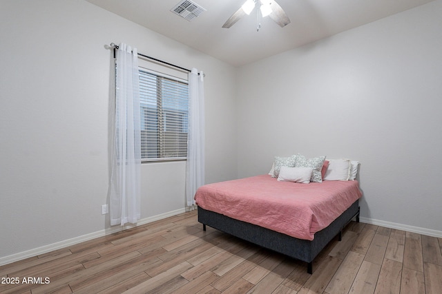 22771 N 98th Dr, Peoria, AZ 85383 - bedroom featuring light wood-style floors, baseboards, and a ceiling fan