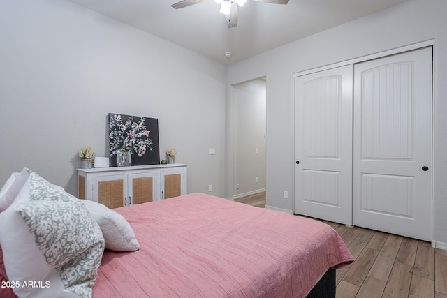 22771 N 98th Dr, Peoria, AZ 85383 - bedroom with light wood finished floors, a closet, baseboards, and ceiling fan