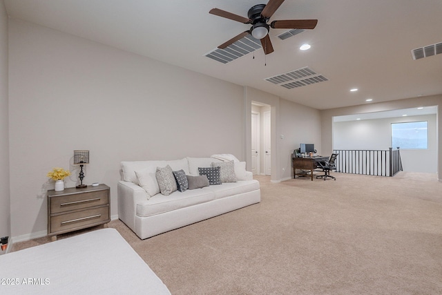 22771 N 98th Dr, Peoria, AZ 85383 - living room with a desk, a ceiling fan, light colored carpet, recessed lighting, and baseboards