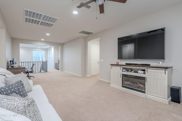 22771 N 98th Dr, Peoria, AZ 85383 - living area featuring light colored carpet, ceiling fan, recessed lighting, and baseboards