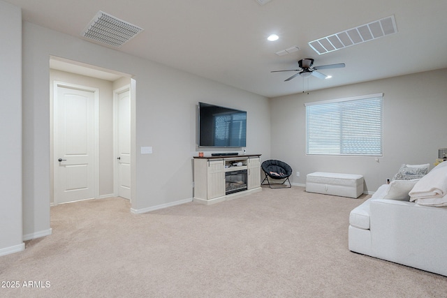22771 N 98th Dr, Peoria, AZ 85383 - living room with a ceiling fan, light colored carpet, baseboards, and recessed lighting
