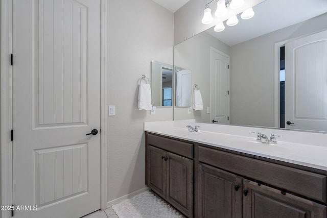 22771 N 98th Dr, Peoria, AZ 85383 - bathroom featuring double vanity and baseboards