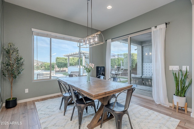 22771 N 98th Dr, Peoria, AZ 85383 - dining space featuring baseboards, wood finished floors, a chandelier, and recessed lighting