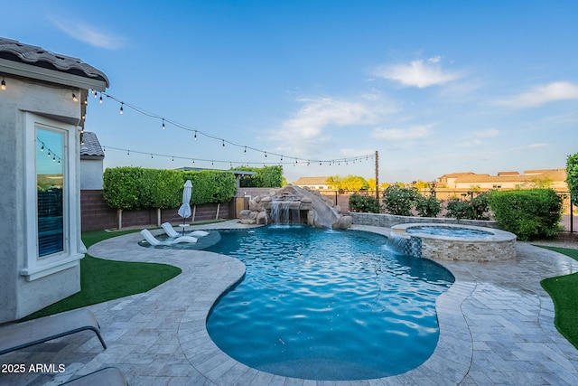 22771 N 98th Dr, Peoria, AZ 85383 - view of swimming pool featuring a fenced backyard, a pool with connected hot tub, and a patio area