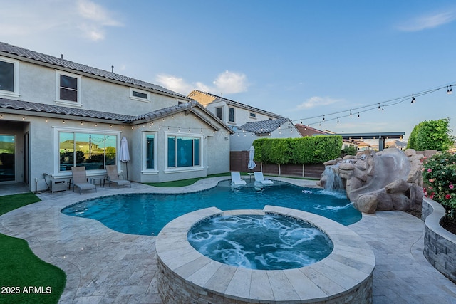 22771 N 98th Dr, Peoria, AZ 85383 - view of pool featuring a pool with connected hot tub, a patio area, and a fenced backyard