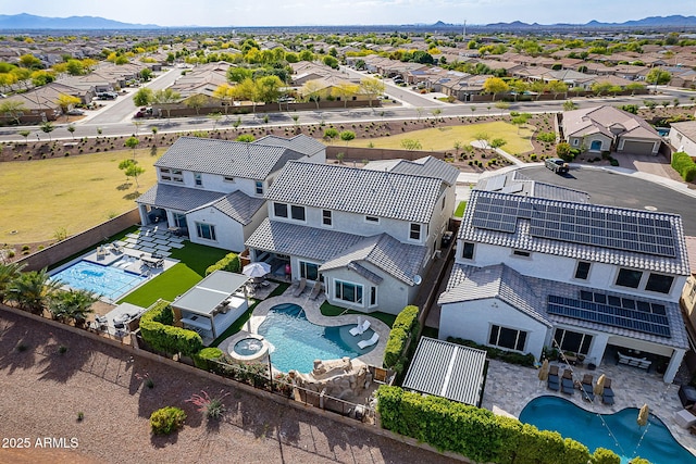 22771 N 98th Dr, Peoria, AZ 85383 - aerial view of residential area with a pool area and a mountain backdrop