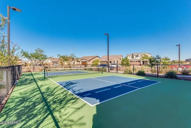 22771 N 98th Dr, Peoria, AZ 85383 - view of tennis court featuring fence, a residential view, and community basketball court