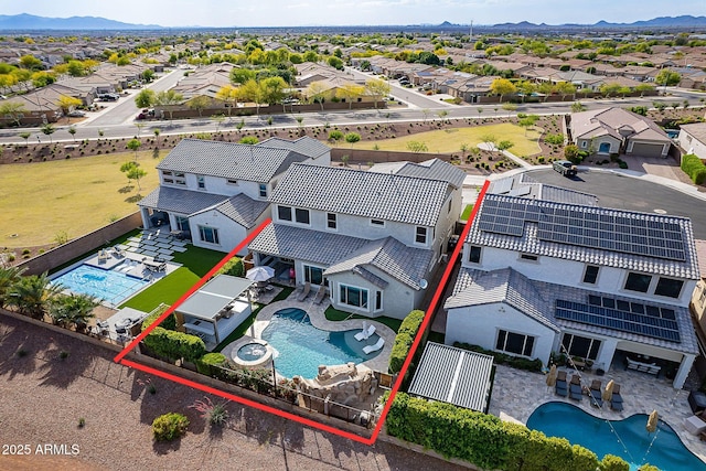22771 N 98th Dr, Peoria, AZ 85383 - aerial perspective of suburban area featuring a pool area, property parcel outlined, and mountains