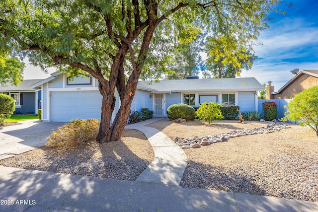 single story home featuring a garage