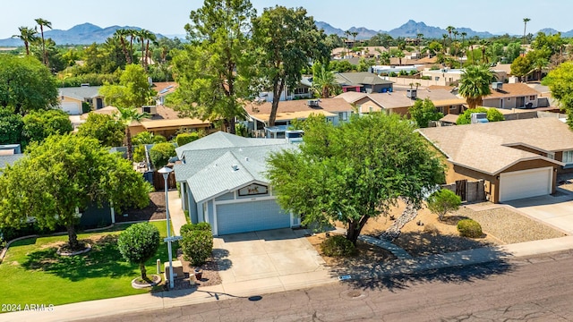 birds eye view of property with a mountain view