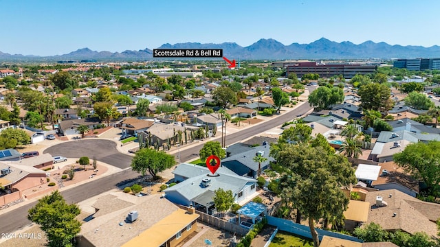 birds eye view of property featuring a mountain view