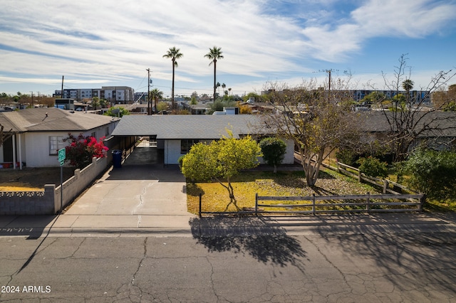 view of front of property with a carport