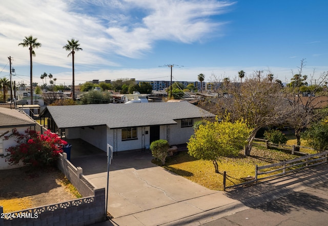 view of front of home with a carport