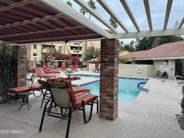 view of pool featuring a pergola and a patio area