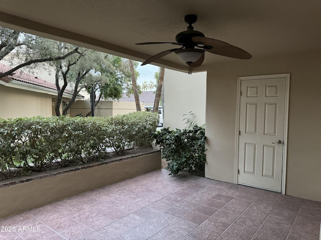 view of patio featuring ceiling fan