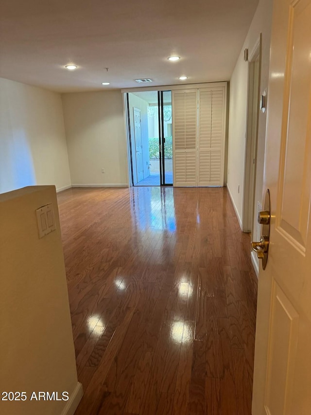 unfurnished room featuring hardwood / wood-style floors