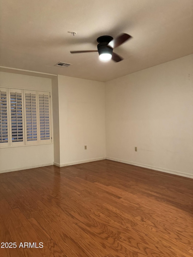 unfurnished room with hardwood / wood-style floors and ceiling fan