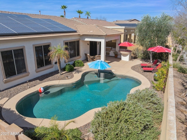 pool featuring a patio area