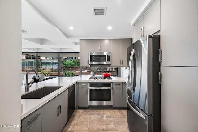 7141 E Rancho Vista Dr Unit 6007, Scottsdale, AZ 85251 - kitchen featuring stainless steel appliances, gray cabinetry, a sink, light countertops, and recessed lighting