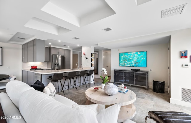 7141 E Rancho Vista Dr Unit 6007, Scottsdale, AZ 85251 - living area featuring baseboards, recessed lighting, and a tray ceiling