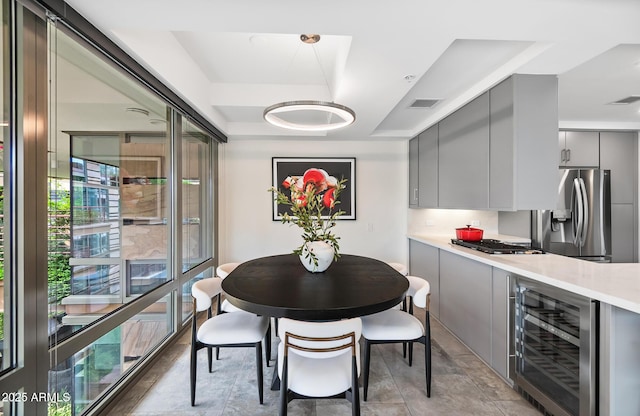 7141 E Rancho Vista Dr Unit 6007, Scottsdale, AZ 85251 - dining room featuring wine cooler and a tray ceiling